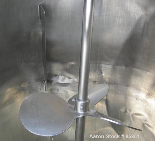 USED: Mueller tank, 300 gallon, 304 stainless steel, vertical. 44" diameter x 42" straight side, dished top and bottom. 1" diameter bottom supported shaft with (2) 3 blade turbines (no drive). 2 Side...
