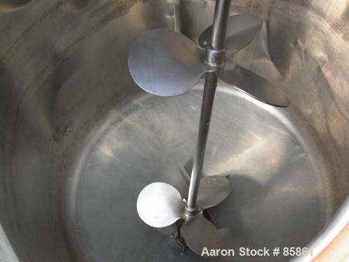 USED: Mueller tank, 300 gallon, 304 stainless steel, vertical. 44" diameter x 42" straight side, dished top and bottom. 1" diameter bottom supported shaft with (2) 3 blade turbines (no drive). 2 Side...