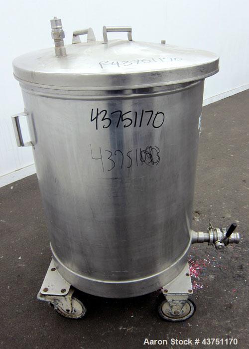 Used Tank, 100 Gallon, 304 Stainless Steel, Vertical. Approximate 31" diameter x 38" straight side. Open top with a 1 piece cover, 1" sloped bottom. 2-1/4" Side bottom outlet. Skirt mounted with cast...