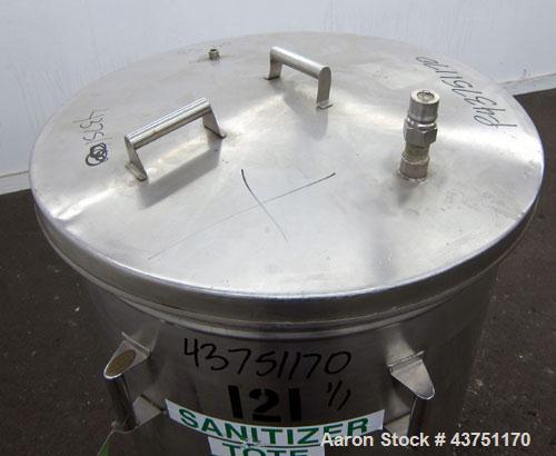 Used Tank, 100 Gallon, 304 Stainless Steel, Vertical. Approximate 31" diameter x 38" straight side. Open top with a 1 piece cover, 1" sloped bottom. 2-1/4" Side bottom outlet. Skirt mounted with cast...