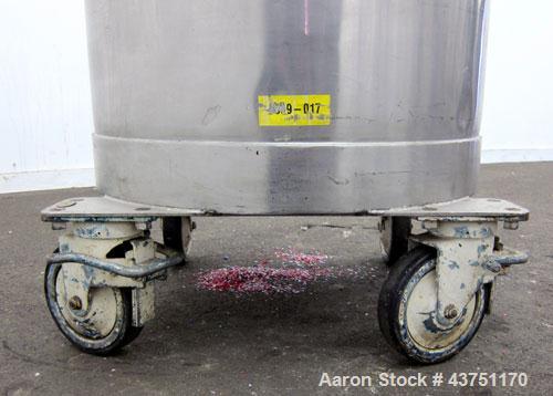 Used Tank, 100 Gallon, 304 Stainless Steel, Vertical. Approximate 31" diameter x 38" straight side. Open top with a 1 piece cover, 1" sloped bottom. 2-1/4" Side bottom outlet. Skirt mounted with cast...