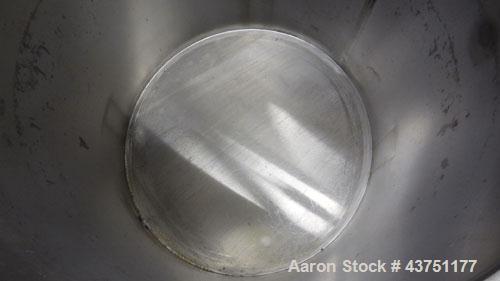 Used Water Cooling Corporation Tank, 100 Gallon, 304 Stainless Steel, Vertical. Approximate 31" diameter x 34" straight side. Flat top with a bolt on hinged cover, 6" sloped bottom. 2" Tri-clamp side...