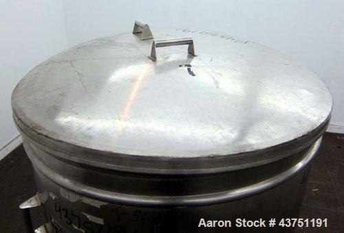 Used Tank, 200 Gallon, 304 Stainless Steel, Vertical.  Approximately 38" diameter x 47" straight side.  Open top with a 1 piece cover, 1/2" sloped bottom. 2-1/4" Side bottom outlet.  Skirt mounted wi...