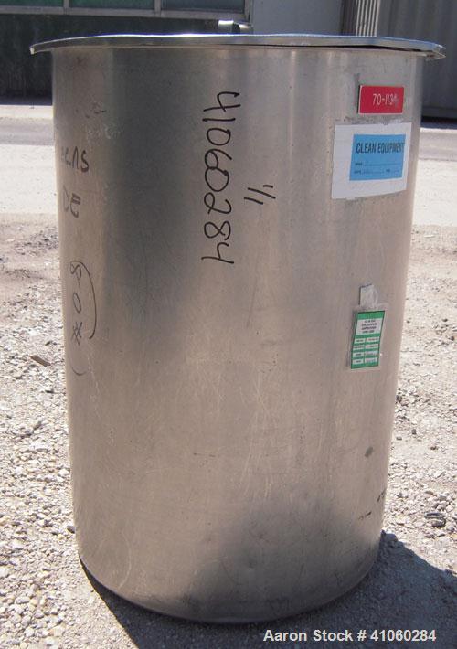 Used Tank/Drum, 70 Gallon, 316 Stainless Steel, Vertical. 24" diameter x 36" deep, flat open top with a cover, flat bottom. 1 1/2" tri-clamp side bottom outlet.