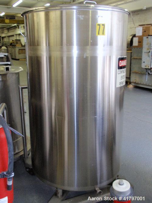 Used Tank, 250 Gallon, Stainless Steel, Vertical. 38" diameter x 58" staight side, open top with cover, flat bottom. 1-1/2" side bottom outlet. Mounted on a base with casters.