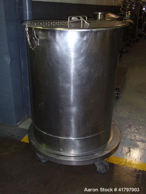 Used Tank, 125 Gallon, Stainless Steel, Vertical. 32" diameter x 40" staight side, open top with cover, flat bottom. 1" side bottom outlet. Mounted on a base with casters.