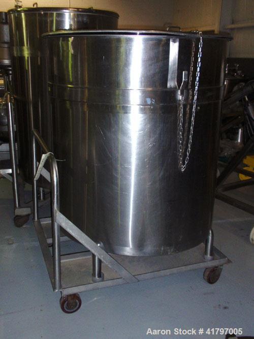 Used Tank, 300 Gallon, Stainless Steel, Vertical. 44"diameter x 46" staight side, open top with cover, flat bottom. 1-1/2" side bottom outlet. Mounted on a base with casters.