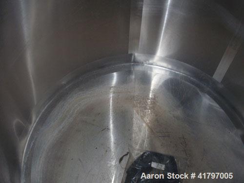 Used Tank, 300 Gallon, Stainless Steel, Vertical. 44"diameter x 46" staight side, open top with cover, flat bottom. 1-1/2" side bottom outlet. Mounted on a base with casters.