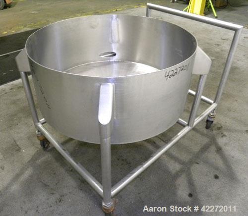 Used Tank, Approximate 40 Gallon, 316 stainless steel, vertical. 32" diameter x 12" straight side. Open top, no cover, coned bottom. 2" Tri-clamp center bottom outlet. Mounted on a stainless steel fr...