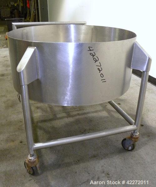 Used Tank, Approximate 40 Gallon, 316 stainless steel, vertical. 32" diameter x 12" straight side. Open top, no cover, coned bottom. 2" Tri-clamp center bottom outlet. Mounted on a stainless steel fr...