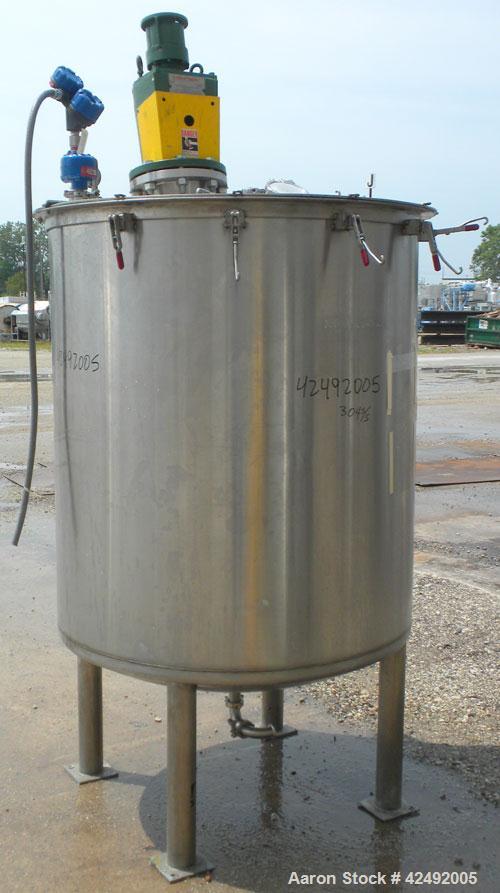Used Tank, 440 Gallon, 304 Stainless Steel, Vertical. 48" Diameter x 52" straight side. Open top with a 2 piece cover, 1/2 bolt on, 1/2 clamp, dished bottom. Off center top entering Lightnin agitator...