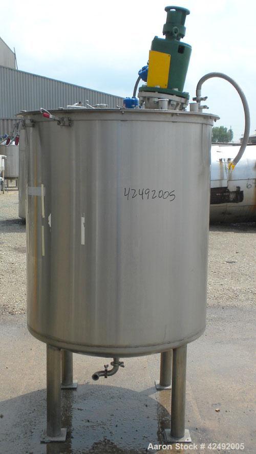 Used Tank, 440 Gallon, 304 Stainless Steel, Vertical. 48" Diameter x 52" straight side. Open top with a 2 piece cover, 1/2 bolt on, 1/2 clamp, dished bottom. Off center top entering Lightnin agitator...