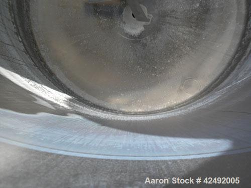 Used Tank, 440 Gallon, 304 Stainless Steel, Vertical. 48" Diameter x 52" straight side. Open top with a 2 piece cover, 1/2 bolt on, 1/2 clamp, dished bottom. Off center top entering Lightnin agitator...