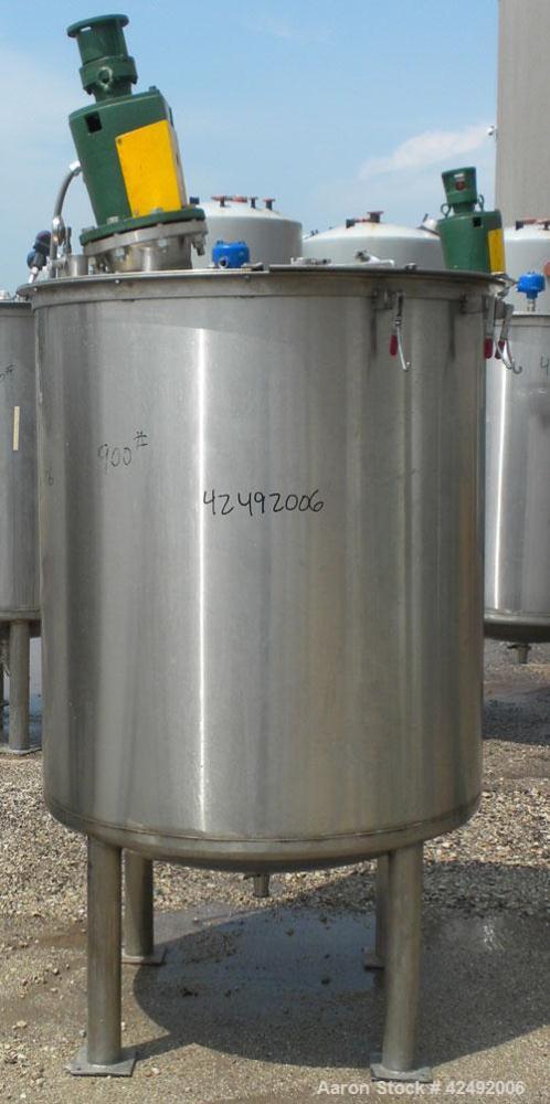 Used Tank, 440 Gallon, 304 Stainless Steel, Vertical. 48" Diameter x 52" straight side. Open top with a 2 piece cover, 1/2 bolt on, 1/2 clamp, dished bottom. Off center top entering Lightnin agitator...