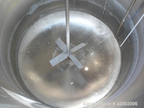 Used Tank, 440 Gallon, 304 Stainless Steel, Vertical. 48" Diameter x 52" straight side. Open top with a 2 piece cover, 1/2 bolt on, 1/2 clamp, dished bottom. Off center top entering Lightnin agitator...