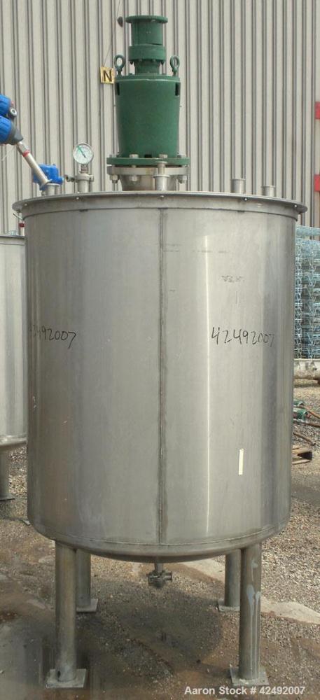 Used Tank, 440 Gallon, 304 Stainless Steel, Vertical. 48" Diameter x 52" straight side. Open top with a 2 piece cover, 1/2 bolt on, 1/2 clamp, dished bottom. Off center top entering Lightnin agitator...