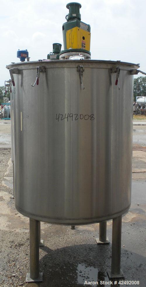 Used Tank, 440 Gallon, 304 Stainless Steel, Vertical. 48" Diameter x 52" straight side. Open top with a 2 piece cover, 1/2 bolt on, 1/2 clamp, dished bottom. Off center top entering Lightnin agitator...