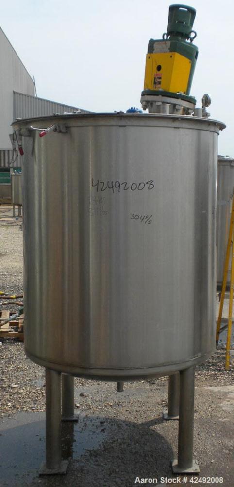 Used Tank, 440 Gallon, 304 Stainless Steel, Vertical. 48" Diameter x 52" straight side. Open top with a 2 piece cover, 1/2 bolt on, 1/2 clamp, dished bottom. Off center top entering Lightnin agitator...
