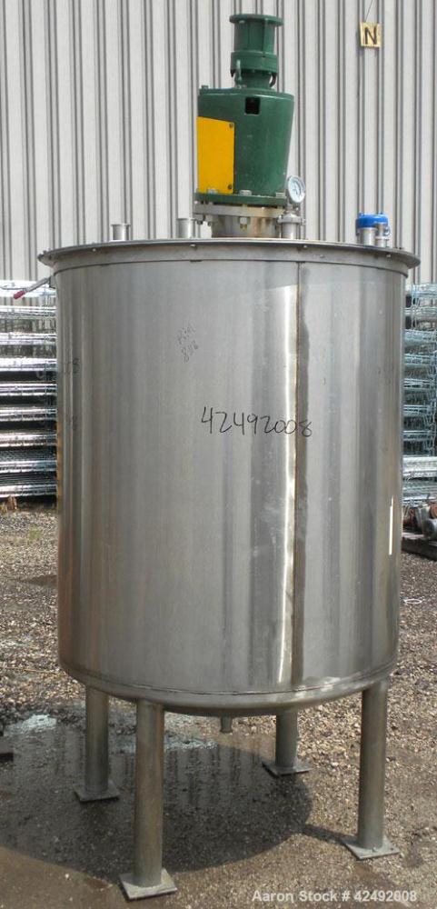 Used Tank, 440 Gallon, 304 Stainless Steel, Vertical. 48" Diameter x 52" straight side. Open top with a 2 piece cover, 1/2 bolt on, 1/2 clamp, dished bottom. Off center top entering Lightnin agitator...