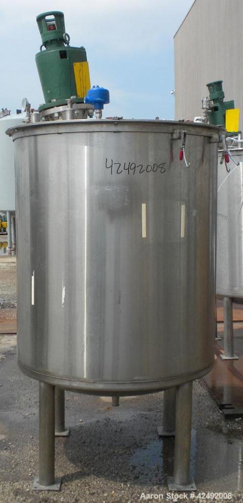 Used Tank, 440 Gallon, 304 Stainless Steel, Vertical. 48" Diameter x 52" straight side. Open top with a 2 piece cover, 1/2 bolt on, 1/2 clamp, dished bottom. Off center top entering Lightnin agitator...