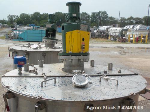 Used Tank, 440 Gallon, 304 Stainless Steel, Vertical. 48" Diameter x 52" straight side. Open top with a 2 piece cover, 1/2 bolt on, 1/2 clamp, dished bottom. Off center top entering Lightnin agitator...