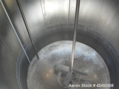Used Tank, 440 Gallon, 304 Stainless Steel, Vertical. 48" Diameter x 52" straight side. Open top with a 2 piece cover, 1/2 bolt on, 1/2 clamp, dished bottom. Off center top entering Lightnin agitator...