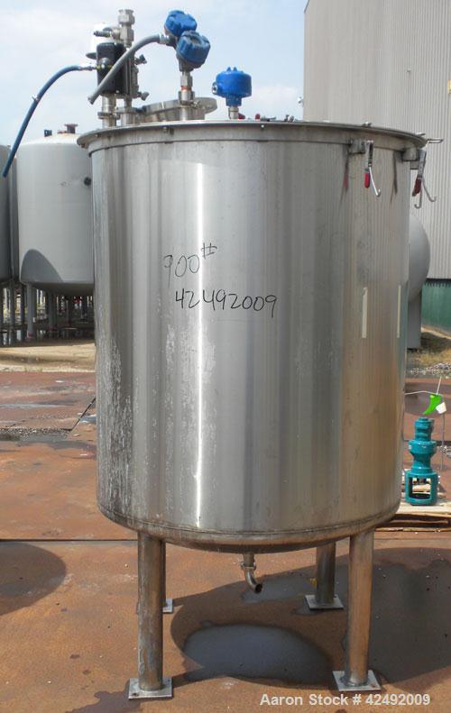 Used Tank, 440 Gallon, 304 Stainless Steel, Vertical. 48" Diameter x 52" straight side. Open top with a 2 piece cover, 1/2 bolt on, 1/2 clamp, dished bottom. Off center top entering Lightnin agitator...