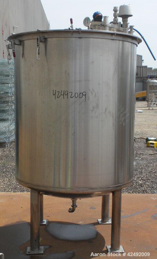 Used Tank, 440 Gallon, 304 Stainless Steel, Vertical. 48" Diameter x 52" straight side. Open top with a 2 piece cover, 1/2 bolt on, 1/2 clamp, dished bottom. Off center top entering Lightnin agitator...