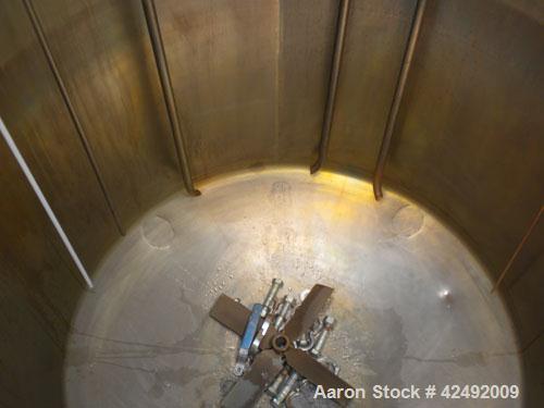 Used Tank, 440 Gallon, 304 Stainless Steel, Vertical. 48" Diameter x 52" straight side. Open top with a 2 piece cover, 1/2 bolt on, 1/2 clamp, dished bottom. Off center top entering Lightnin agitator...