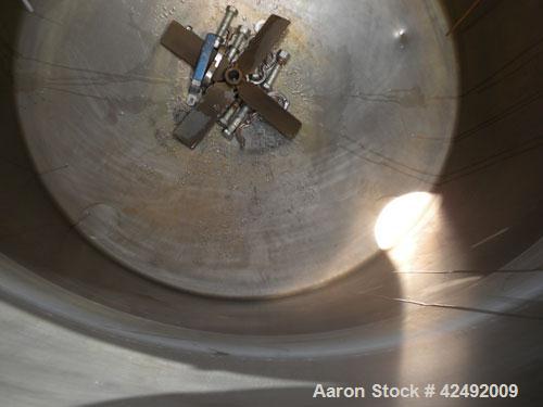 Used Tank, 440 Gallon, 304 Stainless Steel, Vertical. 48" Diameter x 52" straight side. Open top with a 2 piece cover, 1/2 bolt on, 1/2 clamp, dished bottom. Off center top entering Lightnin agitator...