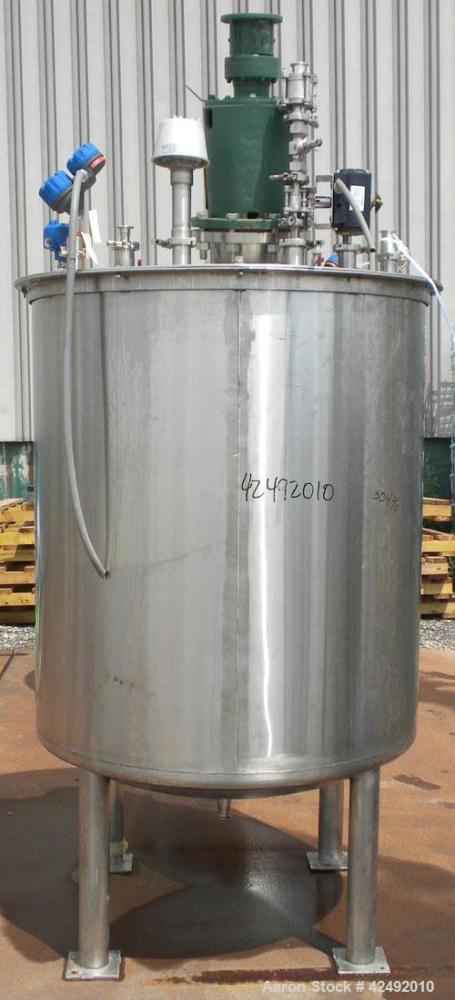 Used Tank, 440 Gallon, 304 Stainless Steel, Vertical. 48" Diameter x 52" straight side. Open top with a 2 piece cover, 1/2 bolt on, 1/2 clamp, dished bottom. Off center top entering Lightnin agitator...