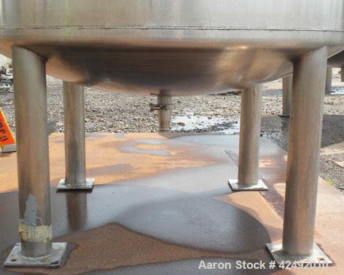 Used Tank, 440 Gallon, 304 Stainless Steel, Vertical. 48" Diameter x 52" straight side. Open top with a 2 piece cover, 1/2 bolt on, 1/2 clamp, dished bottom. Off center top entering Lightnin agitator...