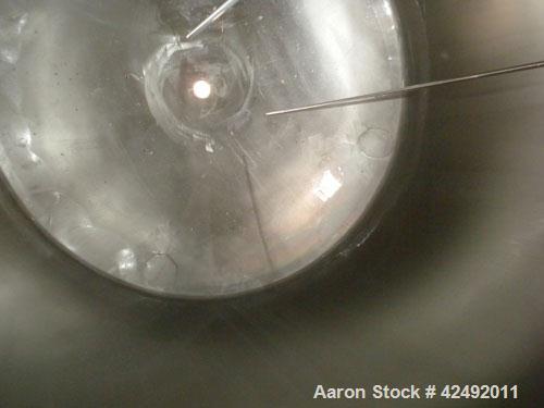 Used Tank, 440 Gallon, 304 Stainless Steel, Vertical. 48" Diameter x 52" straight side, dished top and bottom. Openings: top 1-1/2" tri-clamp, (5) 2" tri-clamp, 12" manway with a 4" tri-clamp in the ...