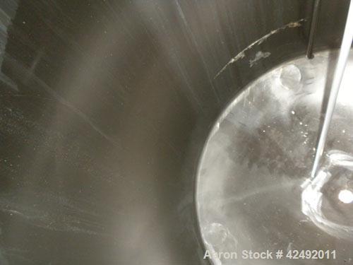 Used Tank, 440 Gallon, 304 Stainless Steel, Vertical. 48" Diameter x 52" straight side, dished top and bottom. Openings: top 1-1/2" tri-clamp, (5) 2" tri-clamp, 12" manway with a 4" tri-clamp in the ...