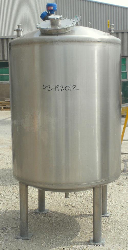 Used Tank, 440 Gallon, 304 Stainless Steel, Vertical. 48" Diameter x 52" straight side, dished top and bottom. Openings: top 1-1/2" tri-clamp, (5) 2" tri-clamp, 12" manway with a 4" tri-clamp in the ...