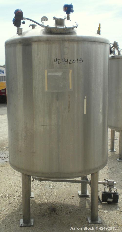 Used Tank, 440 Gallon, 304 Stainless Steel, Vertical. 48" Diameter x 52" straight side, dished top and bottom. Openings: top 1-1/2" tri-clamp, (5) 2" tri-clamp, 12" manway with a 4" tri-clamp in the ...