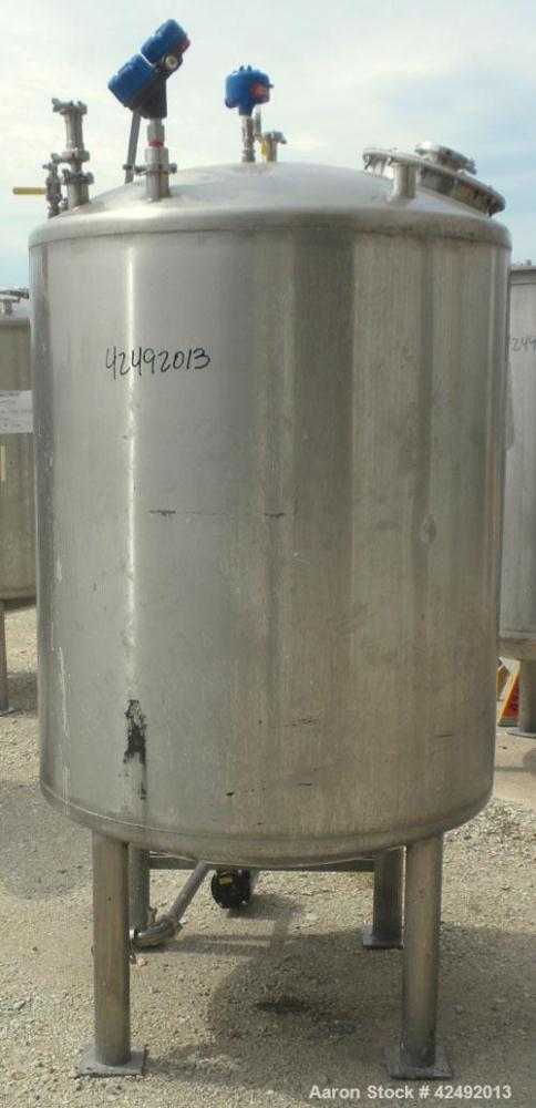 Used Tank, 440 Gallon, 304 Stainless Steel, Vertical. 48" Diameter x 52" straight side, dished top and bottom. Openings: top 1-1/2" tri-clamp, (5) 2" tri-clamp, 12" manway with a 4" tri-clamp in the ...