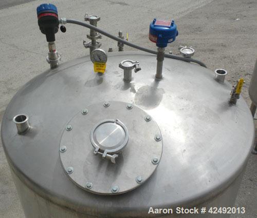 Used Tank, 440 Gallon, 304 Stainless Steel, Vertical. 48" Diameter x 52" straight side, dished top and bottom. Openings: top 1-1/2" tri-clamp, (5) 2" tri-clamp, 12" manway with a 4" tri-clamp in the ...