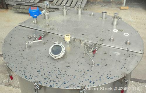 Used Tank, 440 Gallon, 304 Stainless Steel, Vertical. 48" Diameter x 52" straight side. Open top with a 2 piece cover, 1/2 bolt on, 1/2 clamp, dished bottom. Openings: top (6) 2" tri-clamp, 4" sightg...