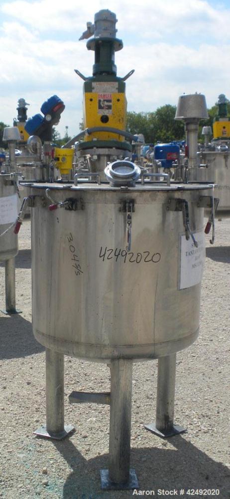 Used Tank, 80 Gallon, 304 Stainless Steel, Vertical. 30" Diameter x 24" straight side. Open top with a 2 piece cover, 1/2 bolt on, 1/2 clamp, dished bottom. Off center top entering Lightnin air opera...