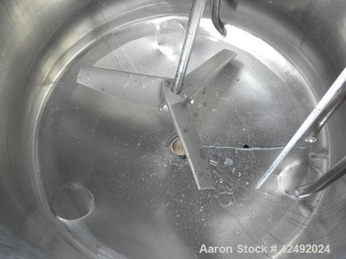 Used Tank, 80 Gallon, 304 Stainless Steel, Vertical. 30" Diameter x 24" straight side. Open top with a 2 piece cover, 1/2 bolt on, 1/2 clamp, dished bottom. Off center top entering Lightnin air opera...