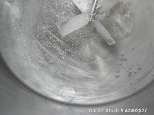 Used Tank, 250 Gallon, 304 Stainless Steel, Vertical. 48" Diameter x 28" straight side. Open top with a 2 piece cover, 1/2 bolt on, 1/2 clamp, dished bottom. Off center top entering Lightnin air oper...
