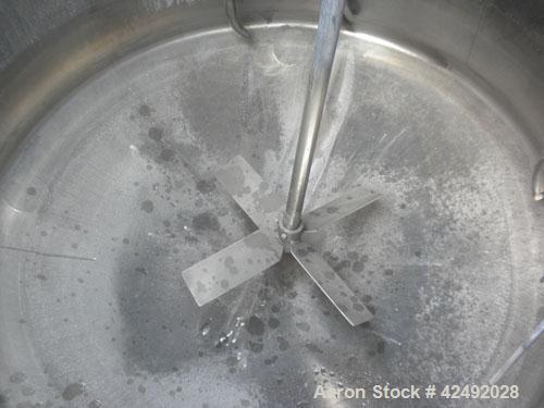 Used Tank, 250 Gallon, 304 Stainless Steel, Vertical. 48" Diameter x 28" straight side. Open top with a 2 piece cover, 1/2 bolt on, 1/2 clamp, dished bottom. Off center top entering Lightnin air oper...