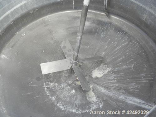 Used Tank, 250 Gallon, 304 Stainless Steel, Vertical. 48" Diameter x 28" straight side. Open top with a 2 piece cover, 1/2 bolt on, 1/2 clamp, dished bottom. Off center top entering Lightnin air oper...