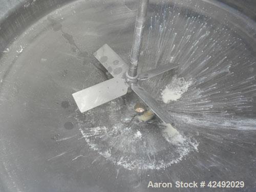 Used Tank, 250 Gallon, 304 Stainless Steel, Vertical. 48" Diameter x 28" straight side. Open top with a 2 piece cover, 1/2 bolt on, 1/2 clamp, dished bottom. Off center top entering Lightnin air oper...