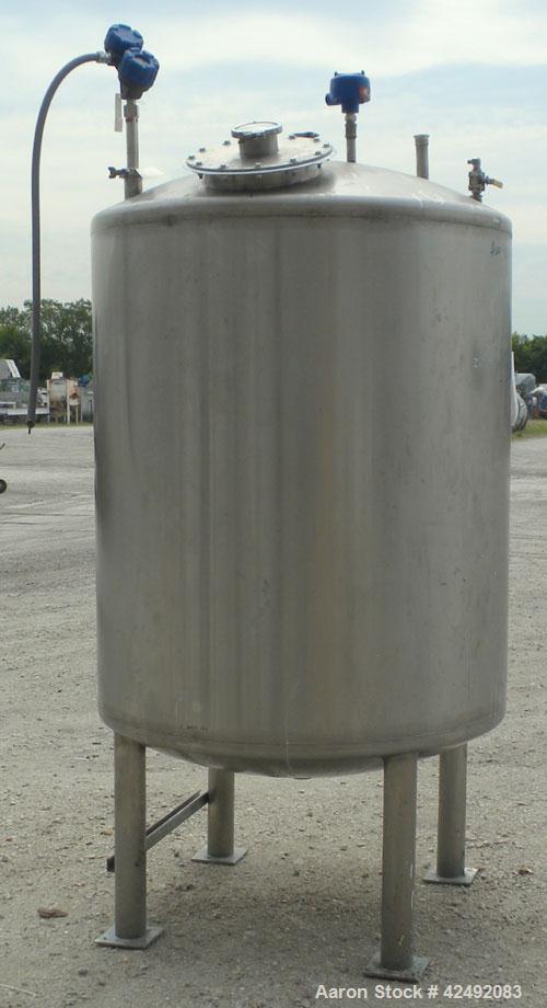 Used Tank, 440 Gallon, 304 Stainless Steel, Vertical. 48" Diameter x 52" straight side, dished top and bottom. Openings: top 1-1/2" tri-clamp, (5) 2" tri-clamp, 12" manway with a 4" tri-clamp in the ...
