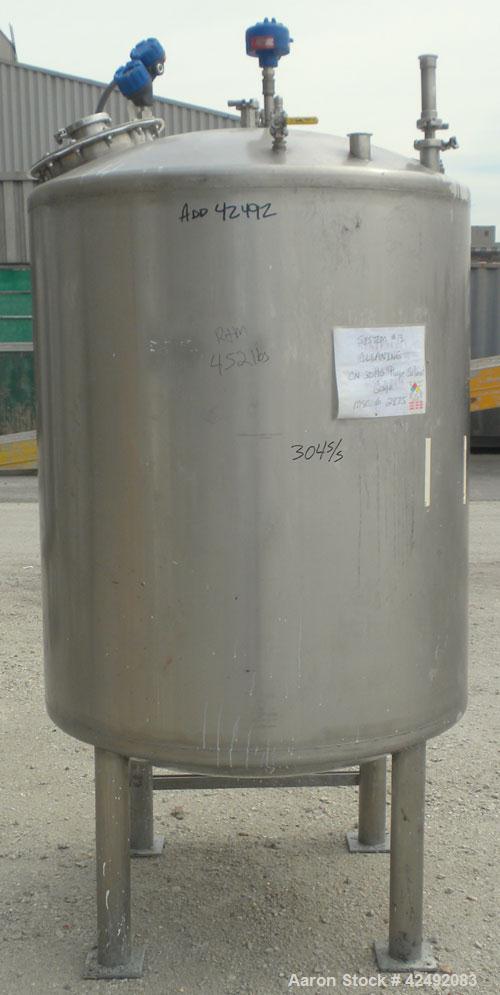 Used Tank, 440 Gallon, 304 Stainless Steel, Vertical. 48" Diameter x 52" straight side, dished top and bottom. Openings: top 1-1/2" tri-clamp, (5) 2" tri-clamp, 12" manway with a 4" tri-clamp in the ...