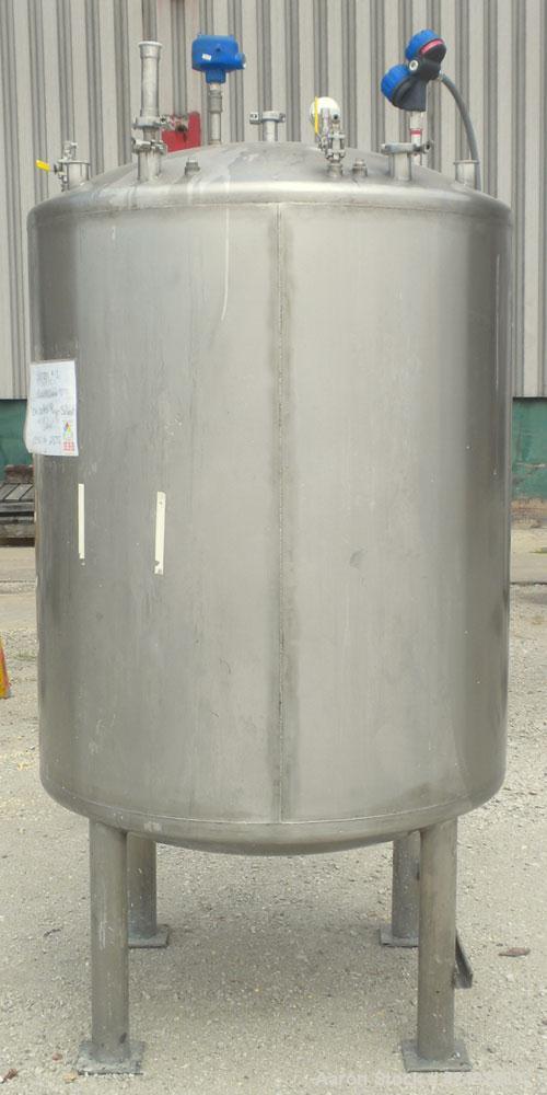 Used Tank, 440 Gallon, 304 Stainless Steel, Vertical. 48" Diameter x 52" straight side, dished top and bottom. Openings: top 1-1/2" tri-clamp, (5) 2" tri-clamp, 12" manway with a 4" tri-clamp in the ...