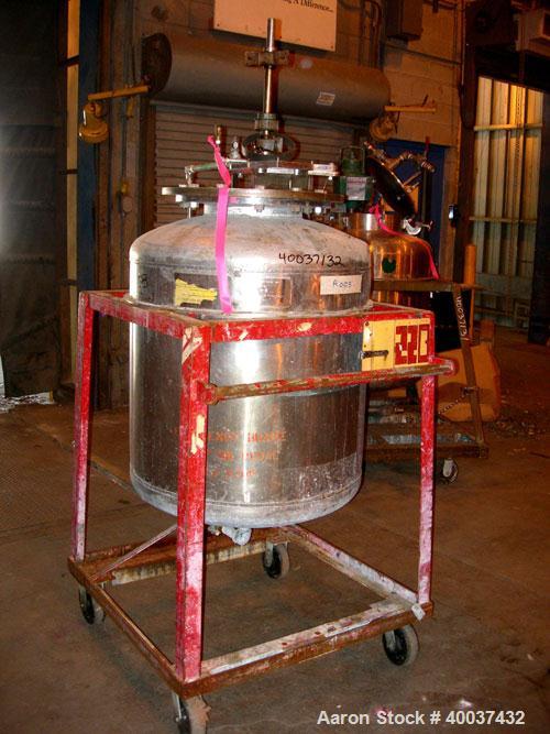 Used Buckley Iron Works Pressure Tank, 100 gallon, stainless steel, vertical. 30" diameter x 30" straight side, dished top and bottom. Internal rated 50 psi at 300 deg F. 12" top manway with cover, 1...