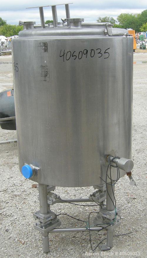 Used Tank, 100 gallon, 321 stainless steel, vertical. 30" diameter x 35" straight side. Flat top with 1/2 hinged cover, sloped bottom. Openings: top 4", (2) 3" tri-clamp; 3" tri-clamp side bottom out...